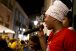 Carine Alves Teles dos Santos sings with the Didá band on the street outside Project Didá in Salvador's historic neighborhood, Pelourinho.
