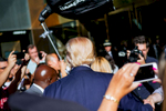 U.S. Presidential Candidate Donald Trump waves to onlookers after emerging briefly from Trump Tower dugong photo shoot Thursday, Sept. 24, 2015, in New York . (AP Photo/Kevin Hagen)
