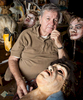 Mask maker, Hunter Spence with some of his creations in his classroom at Yale University. Yale Alumni Magazine. 