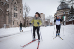 Two undergraduate students and members of the Yale University cross country ski team, take advantage of a snow day and ski on the quiet streets. Yale Alumni Magazine