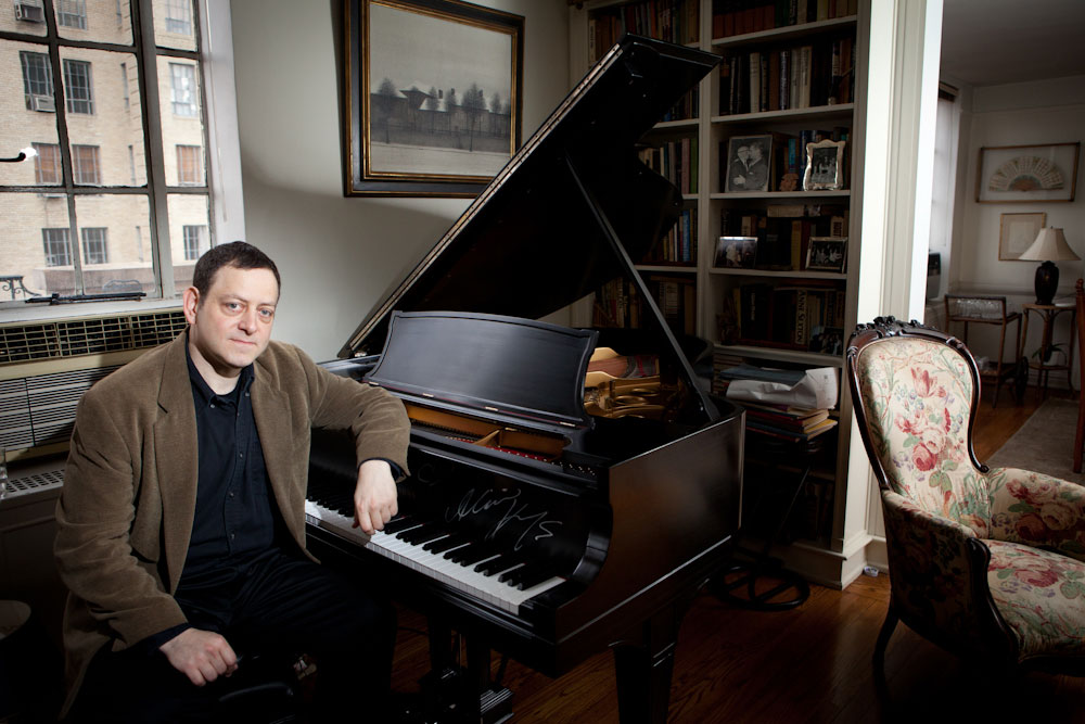 Composer of the music for the Tony Award-nominated Broadway musical TRIUMPH OF LOVE, Jeffrey Stock sits at a piano in a Manhattan apartment. Yale Alumni Magazine.