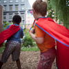 Children dressed in capes run around at a birthday party at el Jardin del Paraiso in the East Village. 