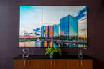Three panels on brushed aluminum equalling an 8'x5' presentation.  Custom trim frame surrouding custom photography of Shamrock Towers in Overland Park, KS commissioned by client. 
