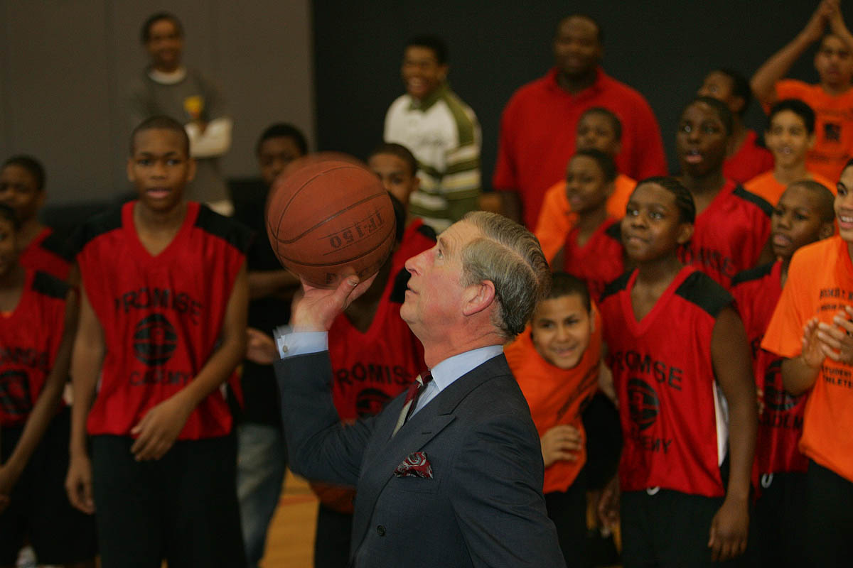 11-19-2007 - Prince Charles of Wales shoots a basketball and scores at the Harlem Children's Zone, to the surprise and delight of students who had just finished scrimmagiing.