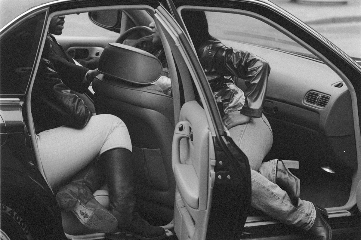 October, 1994 - A conversation underway in the front and back seats of a car parked on 125th street.