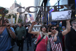 Occupy Wall Street demonstrators march down Broadway in Lower Manhattan.