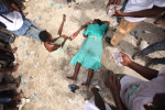 Cite Soleil, Haiti - Deskl: FOR - Slug: - PREVAL-FOOD - These 2 women collapsed while struggling to reach the entrance to this police headquarters where the government of Rene Preval handed out 10,000 bags of food, worth $50 each.  Six thousand of those food bags were provided for those who could bear the crush of the crowd and the high temperature. - Ozier Muhammad/The New York Times