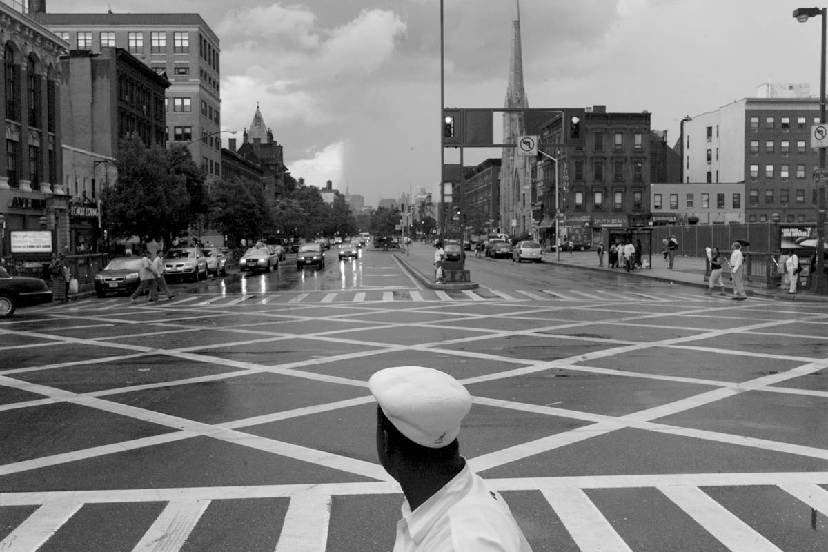 Patterns of white at Martin Luther King and Malcolm X boulevards crossing in Harlem.