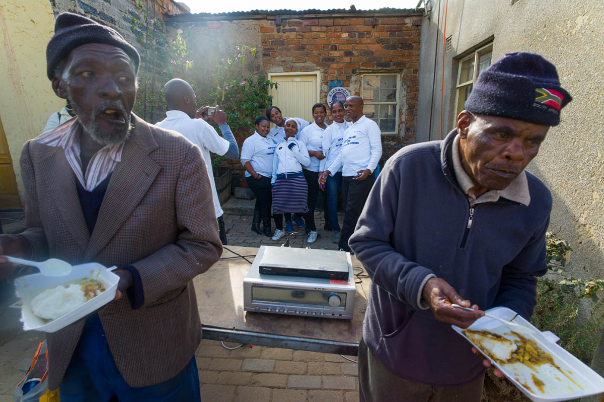 More than 100 senior citizens gathered at The Nelson Mandela Heritage Site here to celebrate Mandela Day. Food, and music was provided by a non-profit organization called Tshedbedisano Support Network. A group of volunteers from a banking concern posed in front of the brick bungalow, in which Nelson Mandela lived when he left the Eastern Cape to move to the greater Johannesburg vicinity in the early 40s. The day was defined as a day to commit oneself to volunteer, to help others for at least 67 minutes, in recognition of the sacrifices Mandela made in his struggle with others, against apartheid over the course of 67 years. 