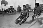 Young men playing pickup basketball in Martin Luther King Jr. Park on the Southside.