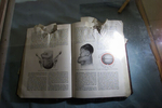 02/06/02   Kabul, Afghanistan - FOR - Slug: UNIV - Several books damaged by the Taliban, some by gunfire, are on display  in the lobby of  the university.  This one turned to pages on birthing was a gynecological book. (digital) Ozier Muhammad/The New York Times 