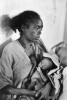 An infant holds onto his mother's breast in a hospital run by Cuban doctors in Addis Ababa. 