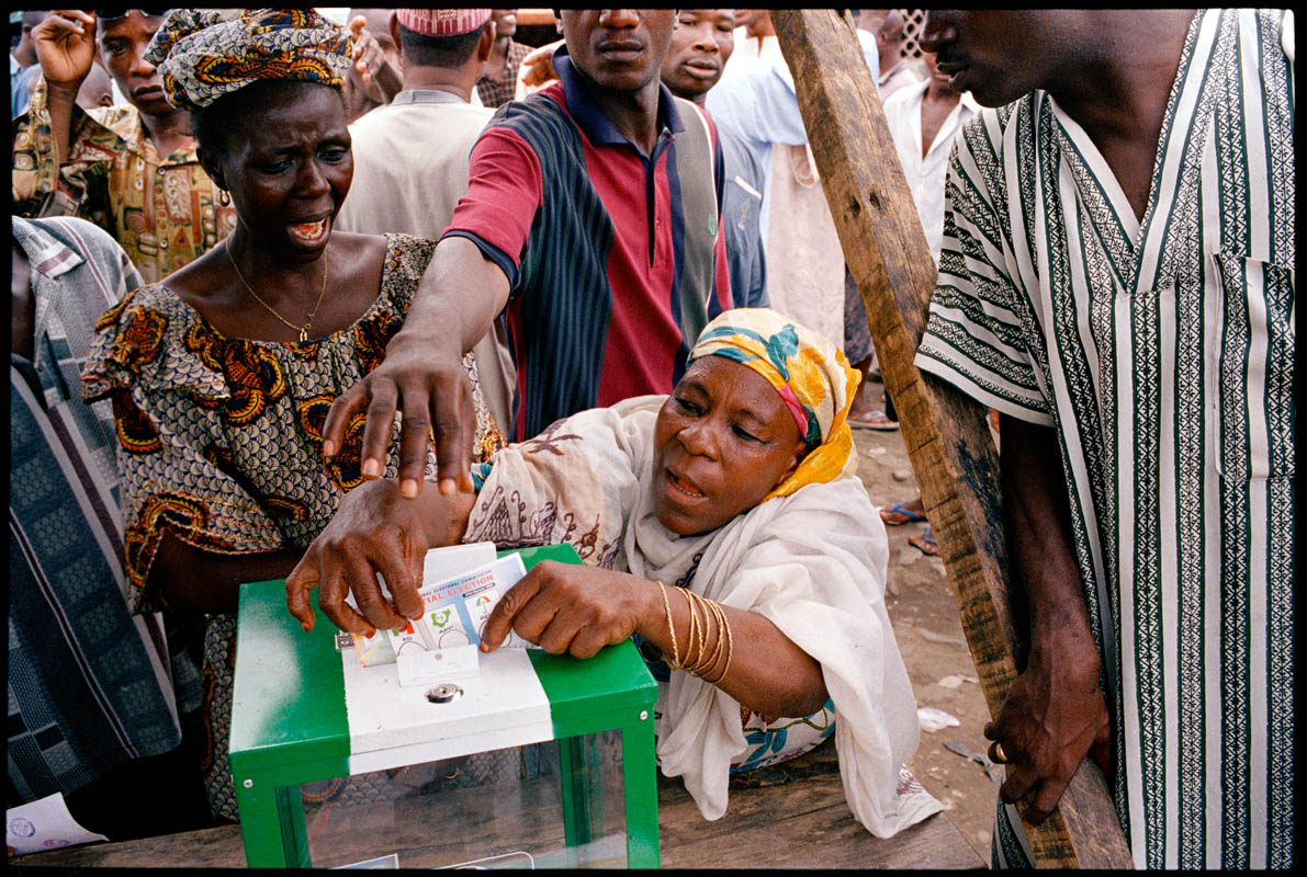 An elderly votes casts her ballot in the first open presidential election in Nigeria's history.