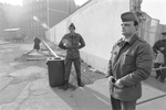 East German soldiers control East Berliners at a checkpoint . November 11, 1989 