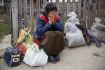 Bosnian refugee after the capture of her village by the Serb militiamen in November 1992