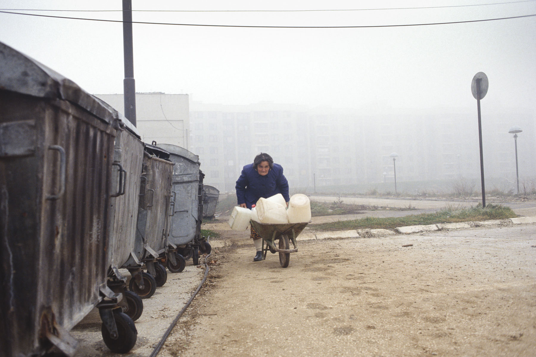 A woman in the area of Dobrinja crosses the street under the Serb snipers’ fire in December 1992
