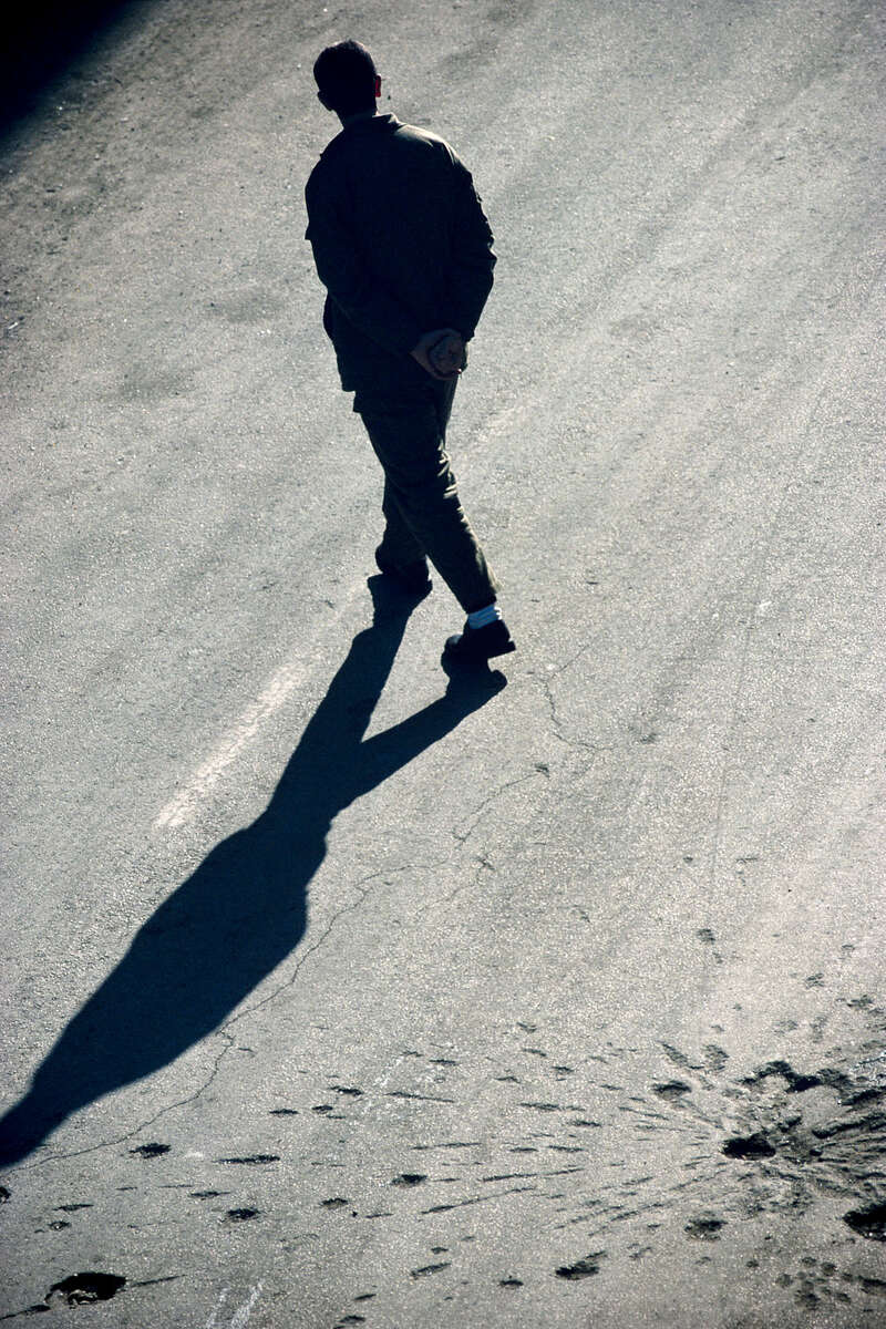 A man walking in a street of the Muslim area of Mostar besieged by the Croatian militias in January 1994