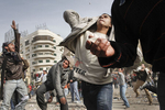 Anti-government demonstrators throw stones during a clash with President Mubarak's supporters on Tahrir Square on Thursday February 3 2011