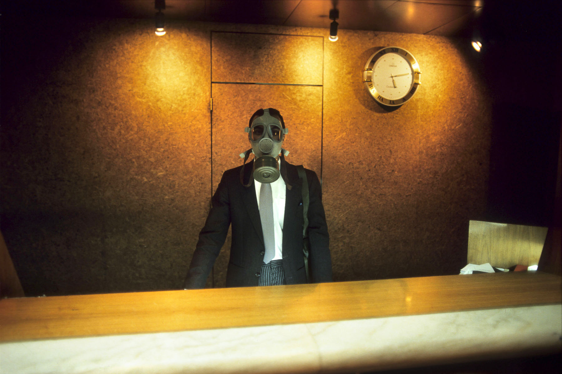 The receptionist of the Meridien hotel with a gas mask during a Scud alert in January 1991
