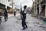 Haitian police stops looting downtown on January 24, 2010
