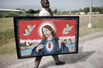 Man carrying a religious painting in October 2003