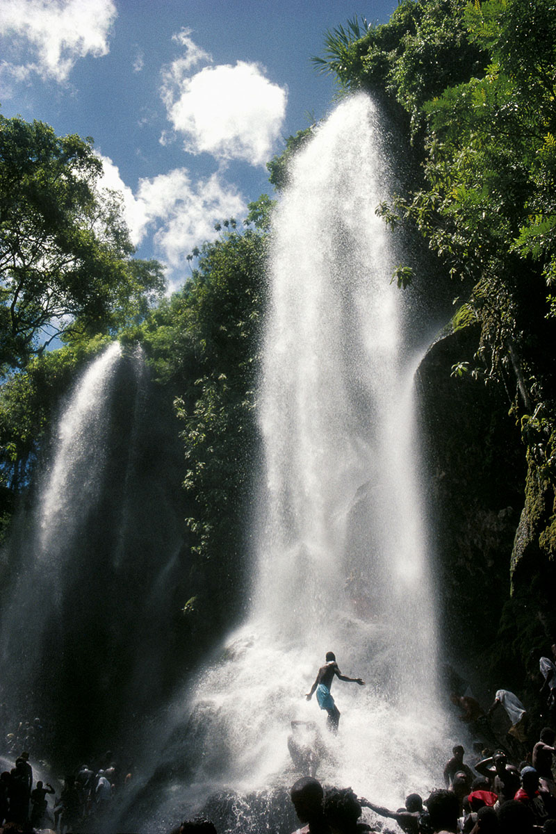 On the day of the celebration of Our Lady of Mount Carmel, believers take a « luck bath » under the waterfall where Erzulie, the loa (voodoo spirit) of femininity, lives in July 1995