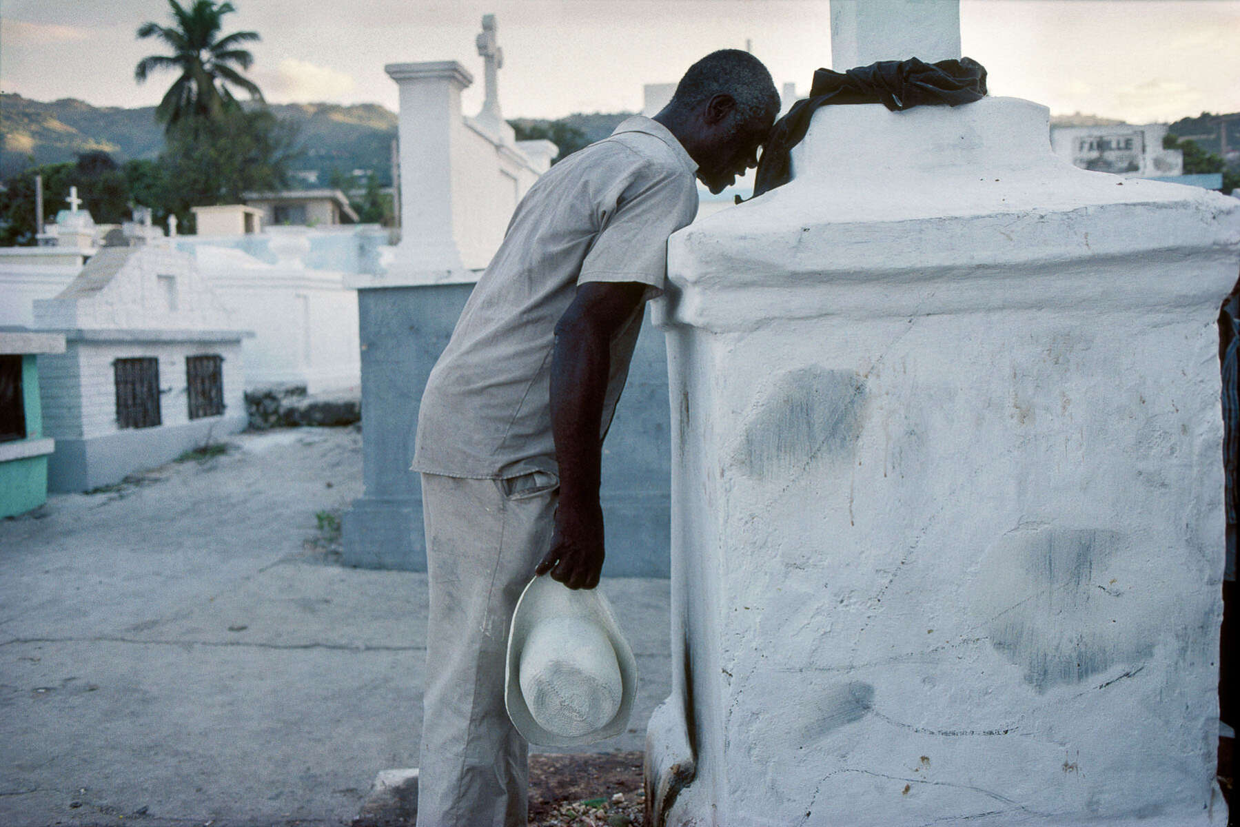 On All Saints’ Day, the Guedes celebration. The voodoo followers gather in the cemeteries around the Cross of Baron Samedi, loa (spirit) of the dead in November 1995