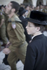 An Ultra-Orthodox Jewish boy and Israeli soldiers by the Western Wall in May 2008