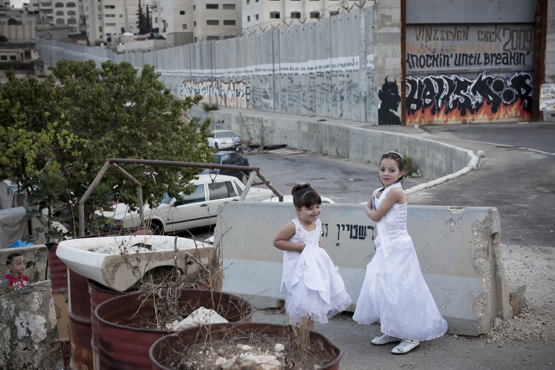Palestinian little girls by the separation wall in October 2010