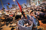Young boys wait for their father during the evening prayer on the new Tahrir Square (Liberty Square) of Benghazi in April 2011