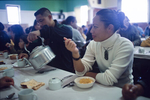 Maoris take breakfast after a funeral at the marae, traditional meeting place in May 2000