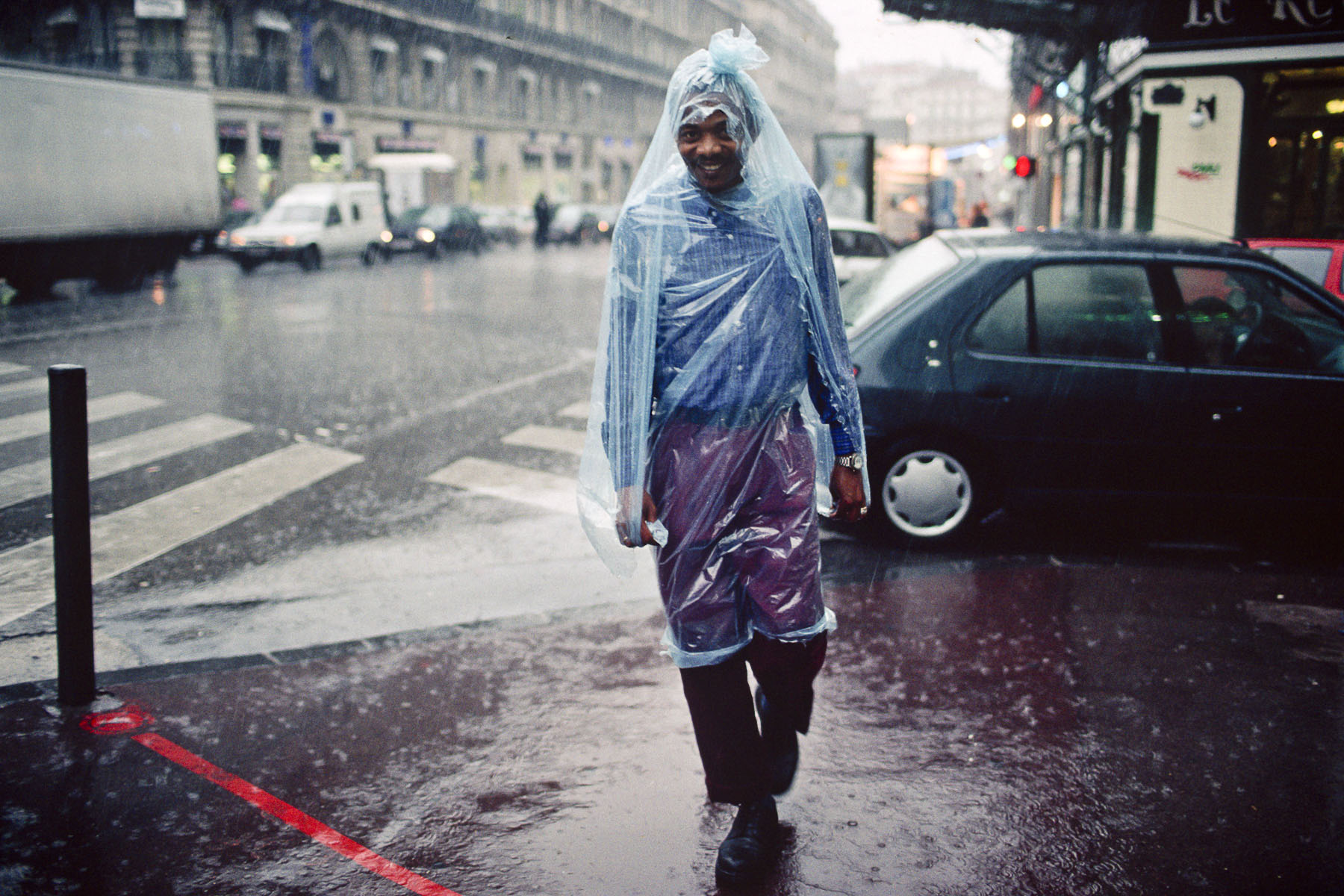 A man under the rain near the Old Port. 2000
