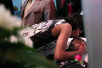 Latayna Herring gave a kiss to her son Jacobi Herring, who was fatally shot while waiting for a bus, during his funeral at Unity Funeral Parlor in Chicago. 