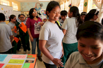 Miluska Elguera greeted students as they file into their classroom at Ricardo Palma School in San Juan de Marcona, Peru. The students are part of an outreach program with Punta San Juan where Elguera comes occasionally to educate them and spread awareness about the reserve.  