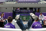 From left, Sean Mansur, 9, Gavin Curran 7, center, and Mason Ressie, 8, played a football video game during the Minnesota Vikings FanFest at U.S. Bank Stadium in Minneapolis.  