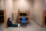 Desiree, 15, a resident at the Pioneer Work & Learn Center operated by Wolverine Human Services sat on the floor near her bed as she waited to be called for lunch in Vassar, Mich. 