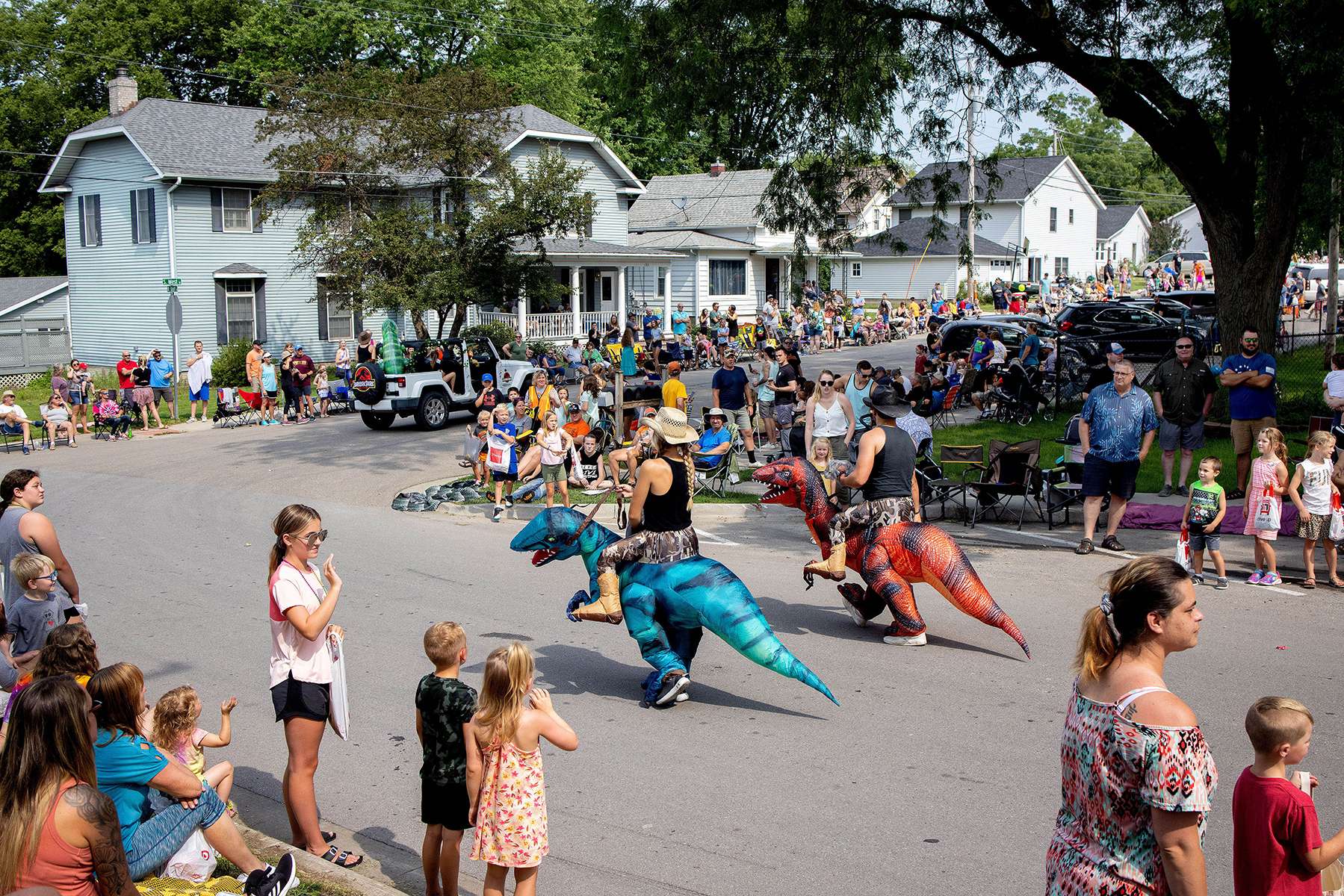 Representatives from the Solon Learning Academy parade through town dressed as dinosaurs to go along with their float’s Jurassic Park theme during the Solon Beef Days Parade in Solon, Iowa on July 17, 2021. According to event organizers, the Solon Beef Days event grew out of a 1971 celebration planned and put on by four civic groups in the town trying to revitalize an “Old Time Celebration.” 