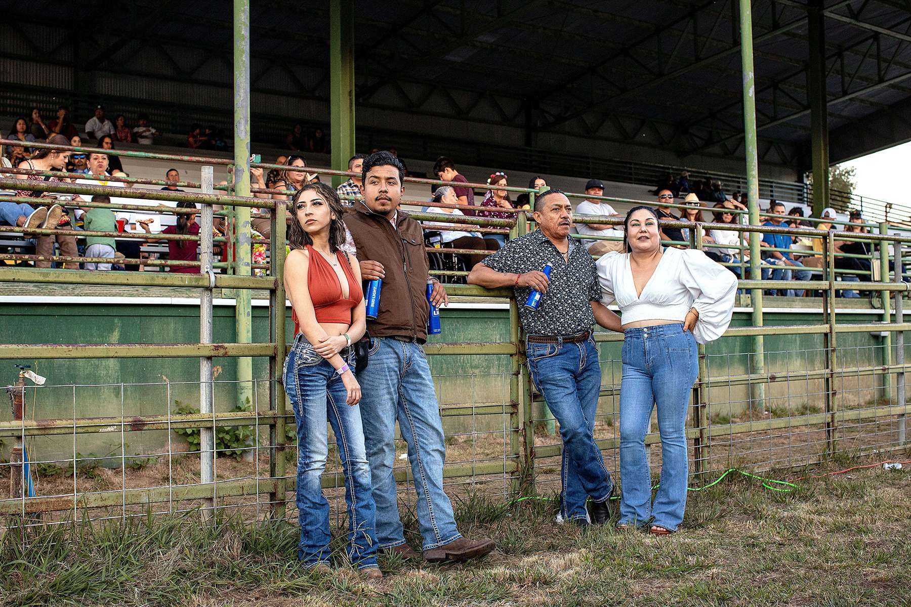 Visitors to the Mendocino County Fair relax and watch others dancing at a party to close out the fair in Boonville, California on September 25, 2022. On each night of the three-day fair, a truck carrying a band was brought into the rodeo arena and fair attendees were able to dance in the large arena space. The county fair, started in 1924, has kept its theme throughout the years of being an old-time harvest festival.