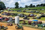 Participants in a tractor pull competition compete on the track at the 31st annual Fawn Grove Olde Tyme Days in Fawn Grove, Pennsylvania on June 27, 2021. The 3-day festival, a celebration of historic farm culture, benefits the town’s Citizens Volunteer Fire Company. Events to raise funds for firefighters are a common summer activity in this area of the country where most fire departments are volunteer.