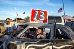 A competitor in the demolition derby gets help from his pit crew in between heats of the event at the Calaveras County Fair & Jumping Frog Jubilee at the Calaveras County Fairgrounds in Angels Camp, California on May 22, 2022. The derby had 18 competitors and was eventually won by a 16-year-old local high school student.