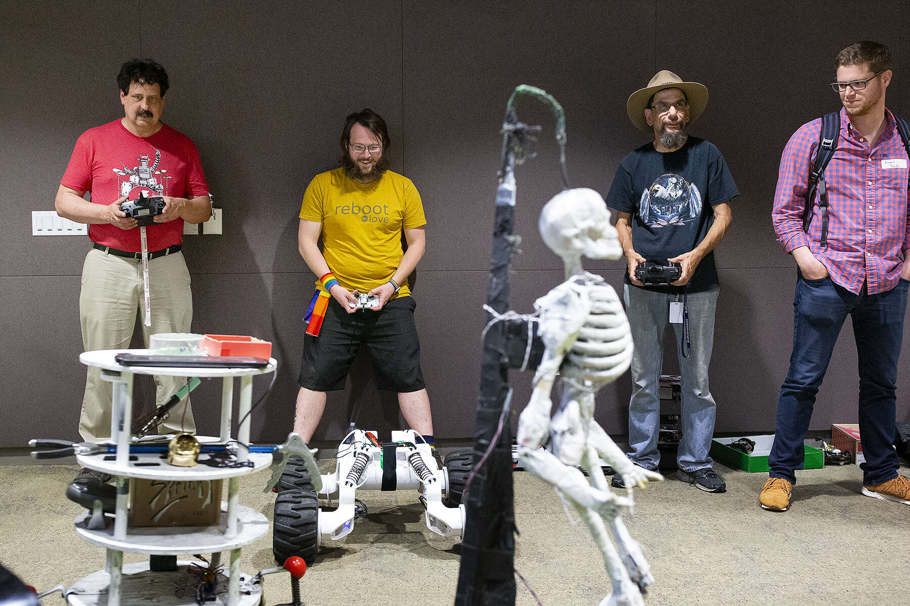 John Erikson (red shirt), Taylor Alexander (yellow shirt) and Stephen Okay (black t-shirt with hat) make their robots dance to music during the {quote}Robot Dance Party{quote} portion of the HomeBrew Robotics Club meeting, in a room donated for use by Google on their campus, during the club's monthly meeting in Mountain View, Calif., on Wednesday, June 27, 2018. The club of robot enthusiasts meets once a month. The HomeBrew Robotics Club grew out of what was the original HomeBrew Computer Club, which was very important in the history of the development of personal computing. The meeting was a special {quote}bot challenge{quote} meeting where members bring robots that can they can use to try to complete one of several challenges. The bot challenge meetings serve to encourage members to work on robots. CONTACTS: John Erikson (red shirt) surf_er_man@yahoo.comTaylor Alexander (yellow shirt)18840 Los Gatos Rd. Los Gatos, CAStephen Okay (black t-shirt)584 Castro Street #304San Francisco, CA 94114