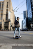 A commuter riding a Onewheel electronic skateboard passes by the building that houses the headquarters of Twitter, located in the Mid-Market neighborhood, in San Francisco, Calif., on September 21, 2018. In 2011 San Francisco passed the controversial Central Market Tax Exclusion to encourage companies to move into the Mid-Market and Tenderloin neighborhoods. Tech giants such as Twitter, Dolby and Uber are now located in the area.