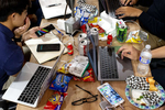 Fueled by snacks, energy drinks, and diet soda, students from Singapore’s Nanyang Technological University develop ideas for an augmented reality app during a hackathon in Santa Clara, Calif., on July 27, 2018. Hackathons, an important part of the tech industry eco-system, are events where software developers and other individuals involved in technology development come together to collaborate on teams and create something in a set period of time, often competing for prizes.