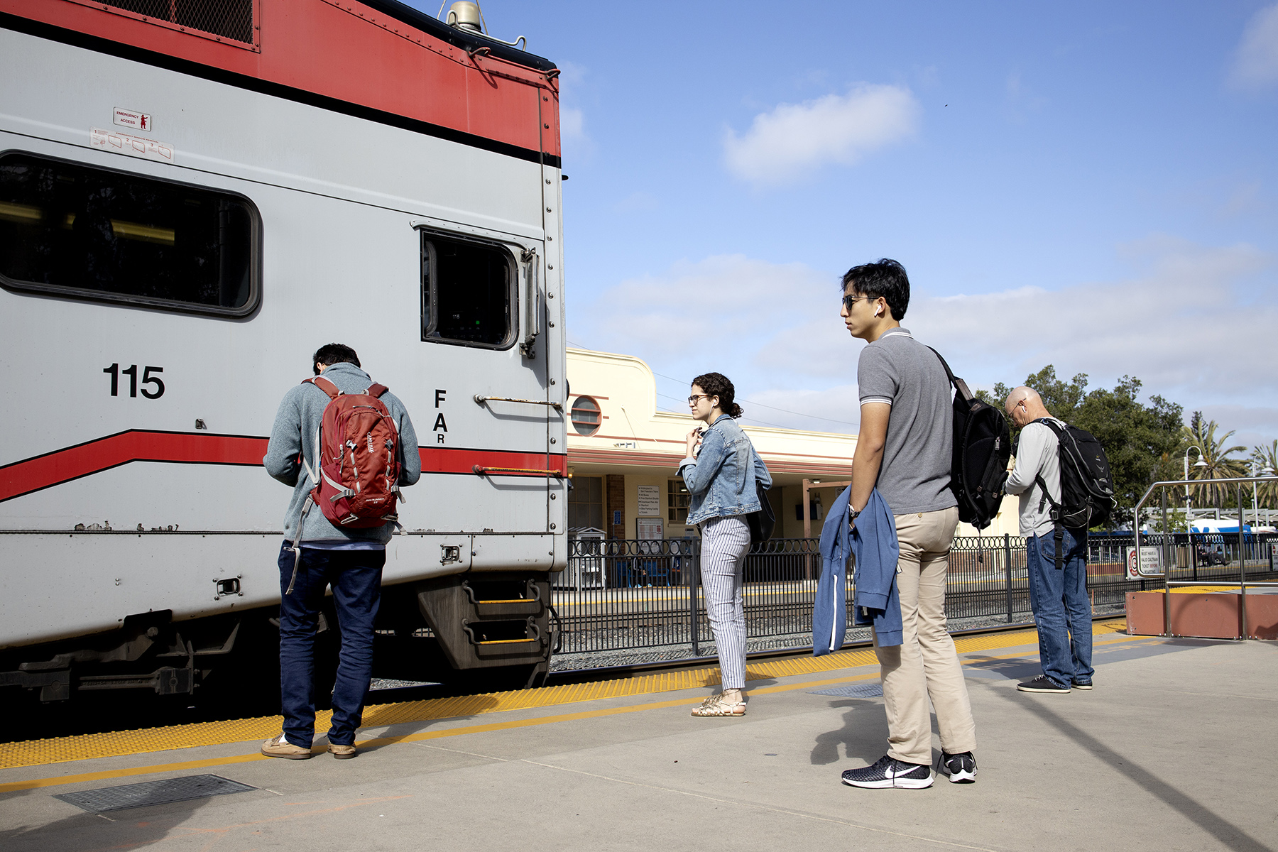 Commuters wait to catch a Northbound train at the Palo Alto Transit Center in Palo Alto, Calif., on June 21, 2019. Palo Alto is the second-busiest Caltrain station after San Francisco, averaging 7,764 weekday boardings by a 2018 count.