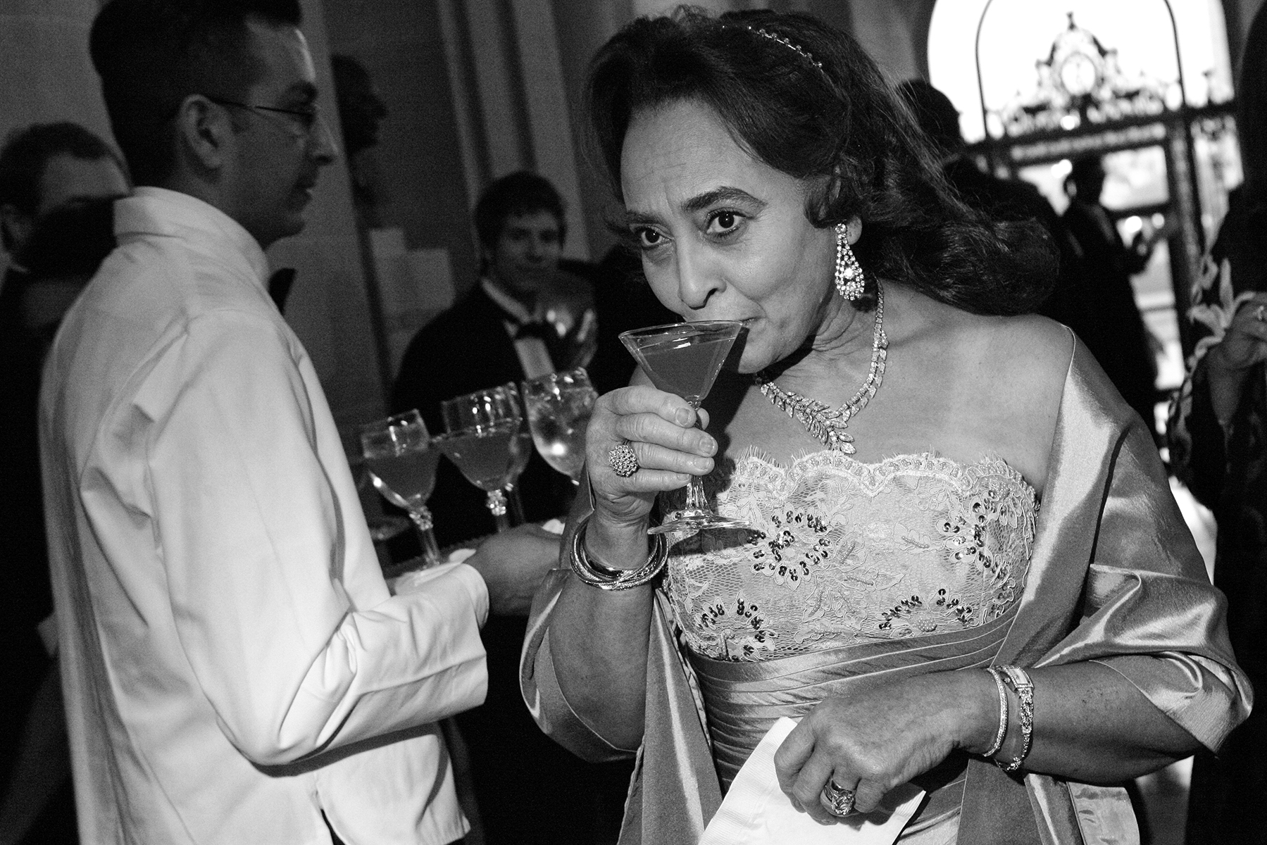 Jewelle Taylor Gibbs takes a sip from her cocktail during a gala to celebrate the first anniversary of the Museum of the African Diaspora at San Francisco City Hall in San Francisco, Calif., on Saturday, March 10, 2007. This photograph is of a candid moment and was not directed in any way.
