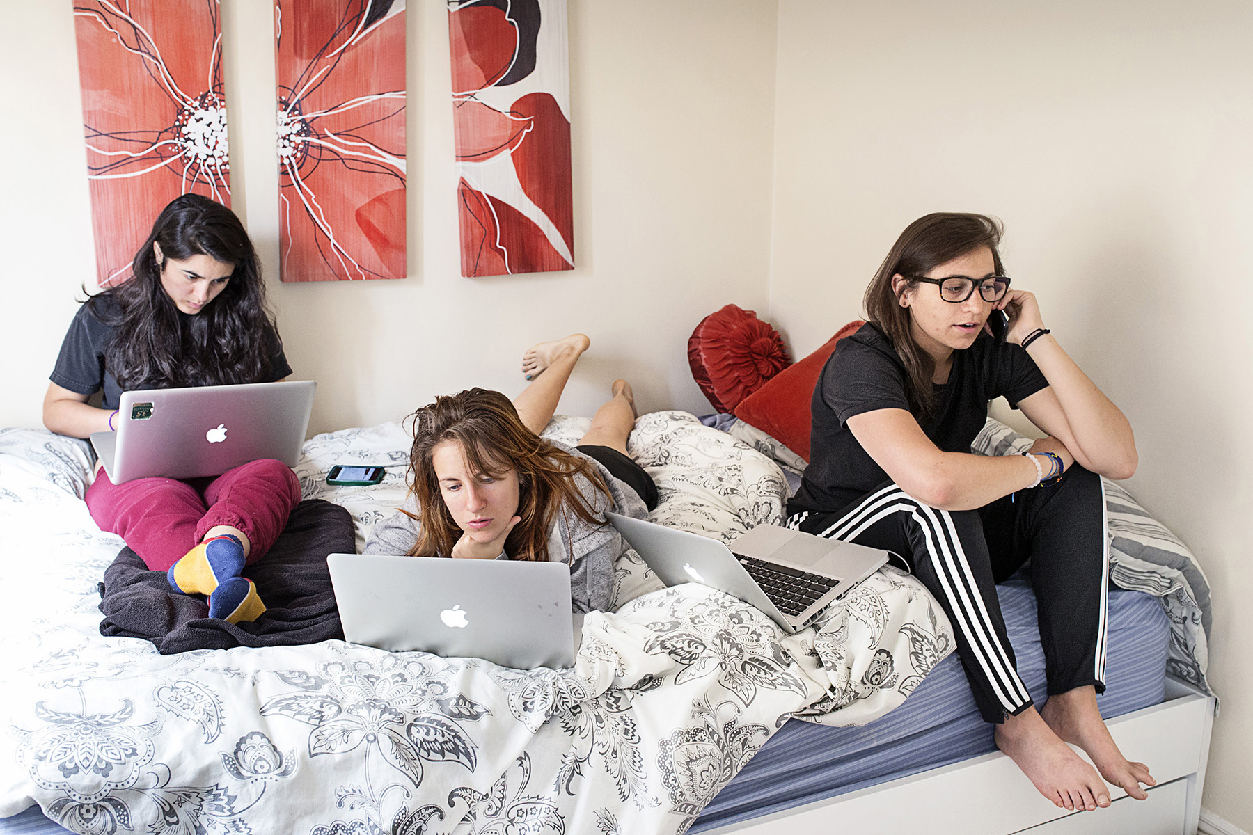 Sandy Frank, Mackenzie Hughes and Danielle Gaglioti, seen left to right, work on a start-up called Akimbo inside the apartment that Hughes and Gaglioti were subletting in San Francisco, California in August 2014. The company, described as a career development platform,is based in New York, but Hughes and Gaglioti were in town for the summer to participate in Tumml, an urban ventures accelerator program. Frank joined them as an intern. They often worked from home depending on their meeting schedule and available transportation options. 