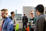 Attendees of the Startup and Tech Mixer, a tech industry networking event, mingle with one another on the roof deck of the W Hotel in San Francisco, California in August 2015. The event drew hundreds of attendees. While many companies could be built anywhere thanks to advances in technology, many entrepreneurs feel they need to be in the area to have the networking opportunities required to raise funding and build their companies.