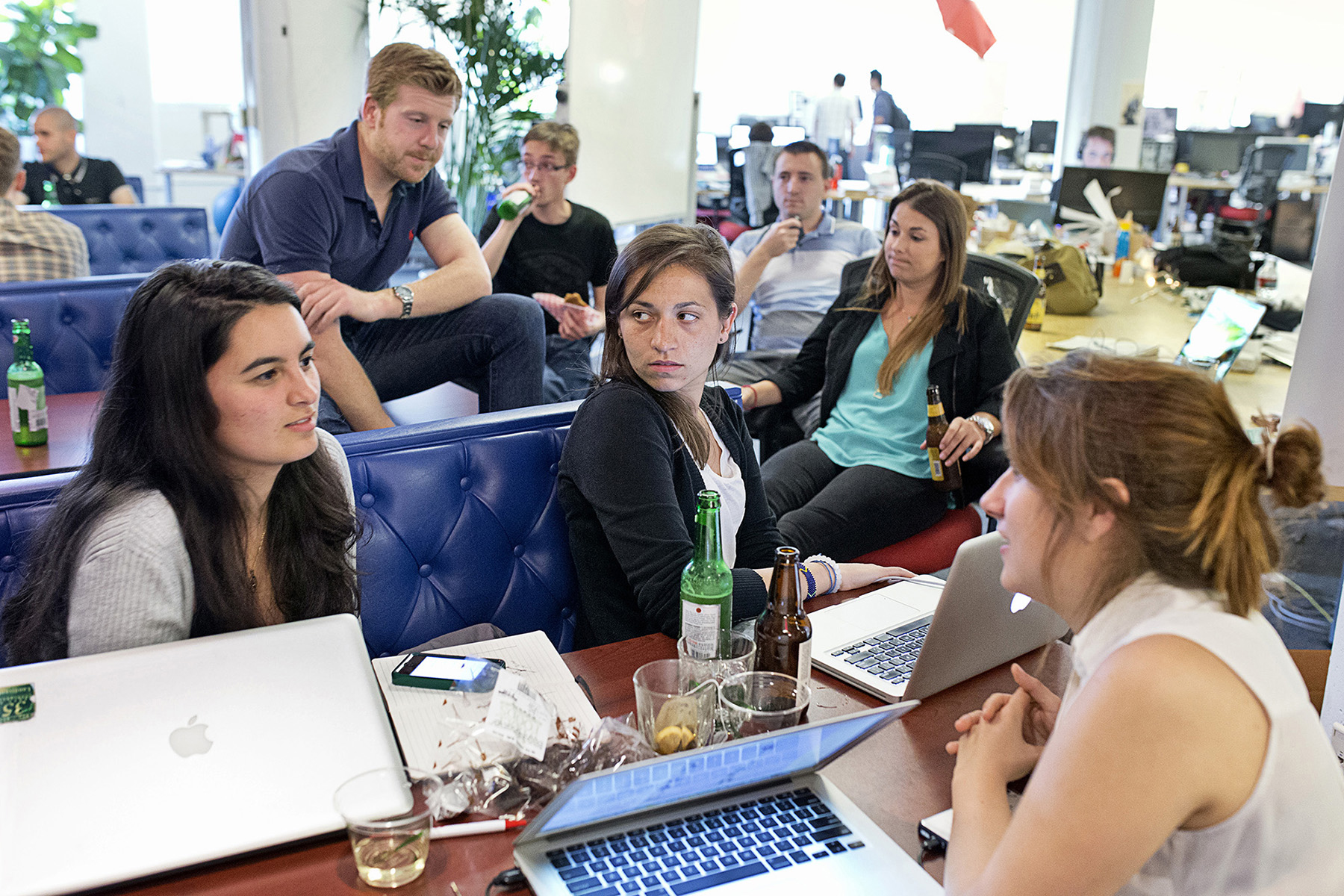 Danielle Gaglioti, center, talks with her co-worker Mackenzie Hughes, right, and their intern Sandy Frank during a happy hour event at the co-working space Hatch Today in San Francisco, Calif., in August 2014. They were working out of Hatch Today for the summer on their company Akimbo while participating in Tumml, an urban venture accelerator program. Co-working spaces are popular with smaller start-ups, both as a way to keep office costs down and to be surrounded by a community of other entrepreneurs. 