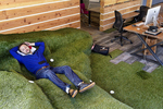 Lev Konstantinovski takes a nap on a break from the data science program he was attending at the co-working space Galvanize in San Francisco, Calif., in March 2015. Galvanize, a hybrid company that combines tech office space with a school, has several campuses around the country in addition to the one in San Francisco. The campus is themed around San Francisco parks, including this common area, which is built to resemble Dolores Park.
