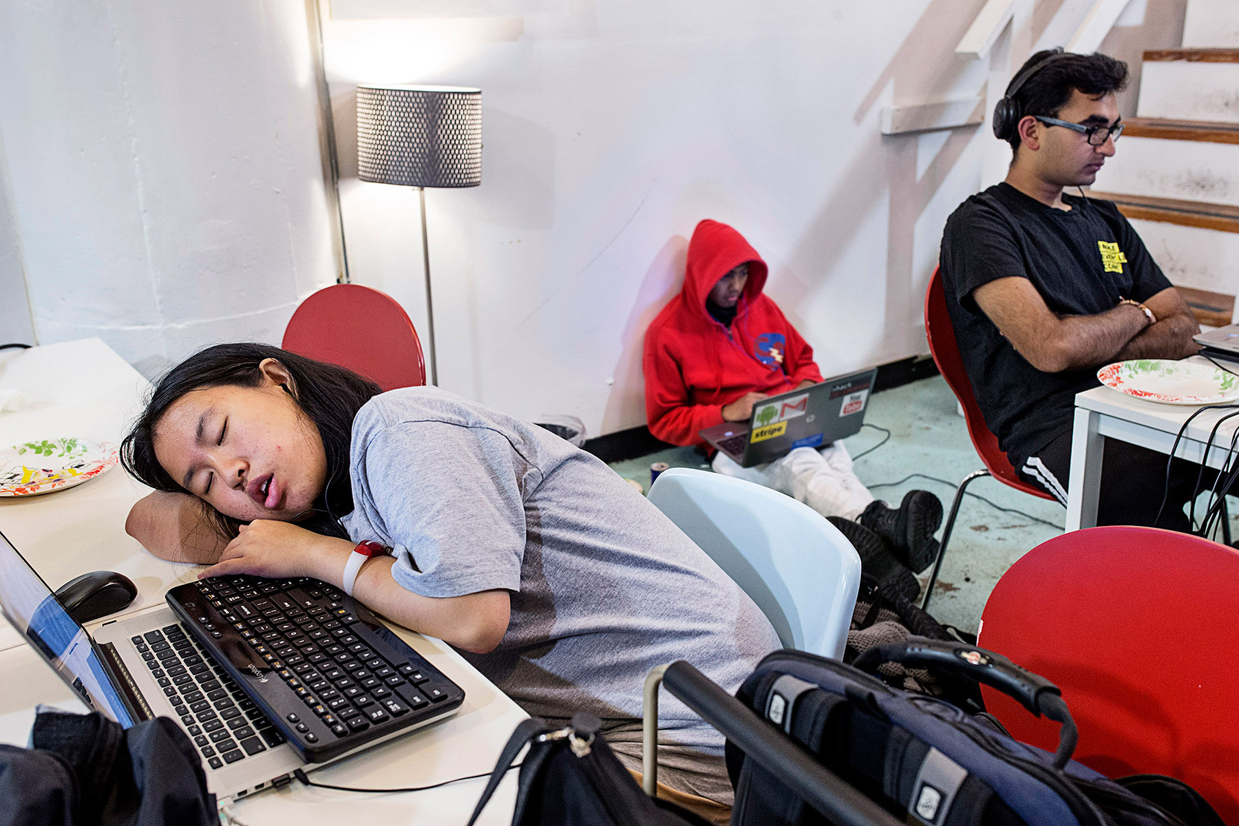A participant in a hackathon organized by the company Shirts.io sleeps at her computer during the in San Francsico, California in August 2014. This hackathon lasted 37 hours and many participants stayed the entire time, taking breaks to sleep where and when they could.